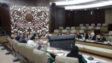 May be an image of 11 people, dais and text that says 